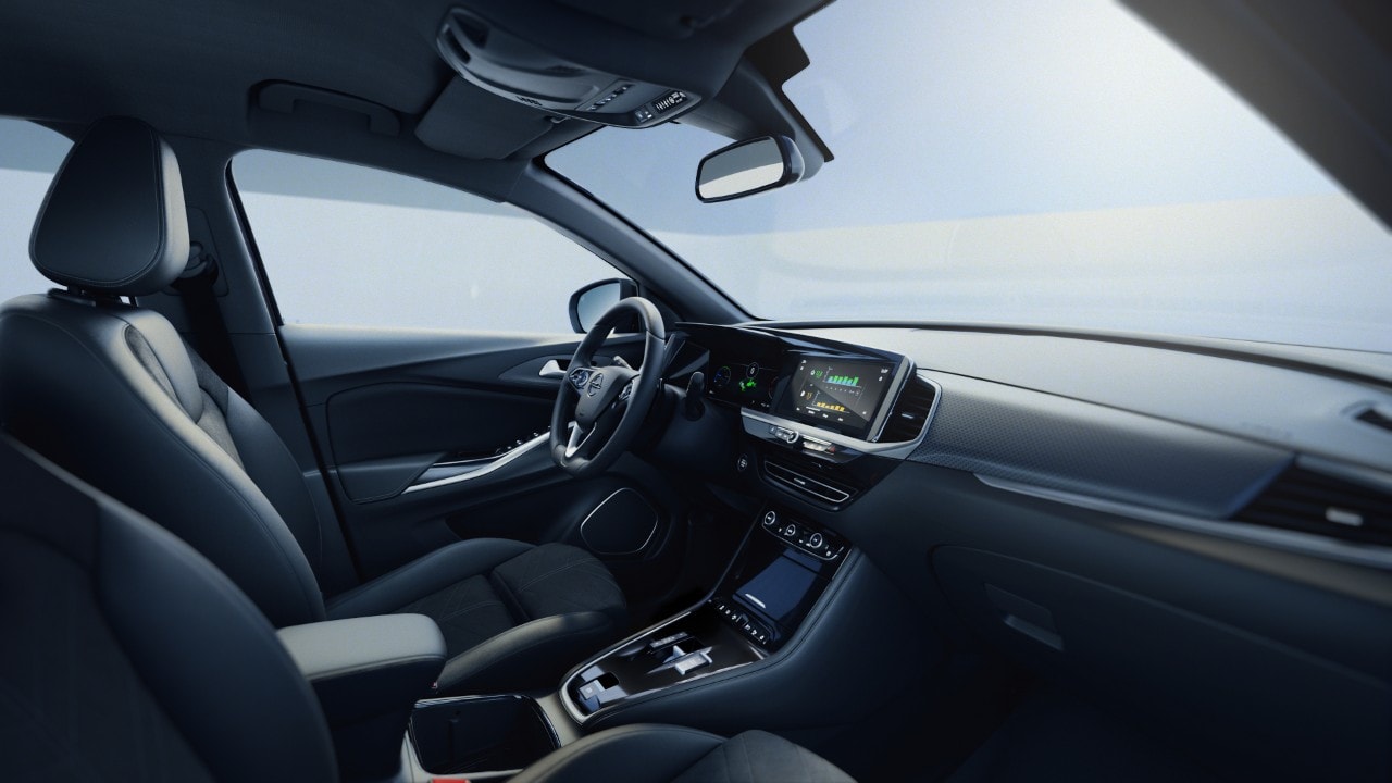 Birds-eye view of a blue Opel Grandland Plug-in-Hybrid with black roof